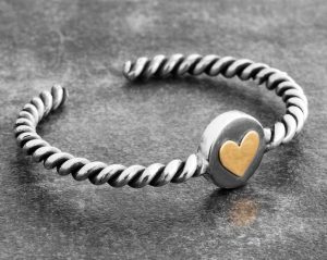 golden cuff with heart symbol